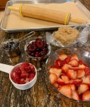 berries, dough, and rolling pin